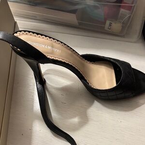 Johnston & Murphy Black leather Strappy Heels with leather soles.